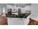 Modern kitchen with white cabinets, granite countertops, and stainless steel appliances at 6204 River Birch Dr, Gastonia, NC 28056