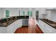 Modern kitchen with stainless steel appliances, granite countertops, and hardwood floors at 6204 River Birch Dr, Gastonia, NC 28056