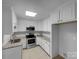 Functional kitchen with neutral countertops, stainless steel appliances, and lots of storage at 6204 River Birch Dr, Gastonia, NC 28056
