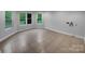 Convenient laundry room features tile flooring and multiple windows for plenty of natural light at 6204 River Birch Dr, Gastonia, NC 28056