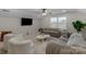Cozy living room with plush seating, ceiling fan and a wall-mounted TV for entertainment at 8008 Hudson Mill Dr, Waxhaw, NC 28173