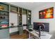 Comfortable home office with custom built-in shelving and unique decorative accents at 8008 Hudson Mill Dr, Waxhaw, NC 28173