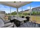 Inviting screened porch with comfortable seating and views of the backyard and neighborhood at 8008 Hudson Mill Dr, Waxhaw, NC 28173