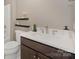 Well-lit bathroom with a modern vanity, sleek fixtures, and minimalist shelves, offering a clean and functional design at 804 Birdsong Way, Fort Mill, SC 29715