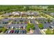 View showcasing community clubhouse surrounded by ample parking and professionally landscaped grounds at 804 Birdsong Way, Fort Mill, SC 29715