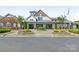 Inviting clubhouse exterior with manicured landscaping, providing a welcoming community gathering space at 804 Birdsong Way, Fort Mill, SC 29715