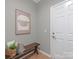 Inviting entryway featuring a stylish bench and artwork, creating a warm welcome into the home at 804 Birdsong Way, Fort Mill, SC 29715