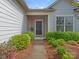 Inviting front entrance with a dark door, trimmed bushes, and a well-manicured walkway at 804 Birdsong Way, Fort Mill, SC 29715