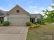 Charming single-Gathering home with a two-car garage, complemented by lush landscaping and inviting curb appeal at 804 Birdsong Way, Fort Mill, SC 29715