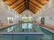 Bright and spacious indoor pool area with high ceilings and ample natural light at 804 Birdsong Way, Fort Mill, SC 29715