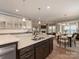 Beautiful kitchen features a large center island with granite countertops and an attached dining area at 804 Birdsong Way, Fort Mill, SC 29715