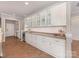 Bright kitchen with white cabinets, granite countertops, and plenty of storage space at 804 Birdsong Way, Fort Mill, SC 29715