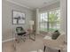 Bright office with a sleek desk, comfortable seating, and a large window with green outdoor views at 804 Birdsong Way, Fort Mill, SC 29715