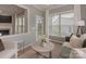 Cozy sitting area with a fireplace and natural light provides a comfortable retreat at 804 Birdsong Way, Fort Mill, SC 29715
