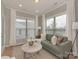 Bright sitting area features large windows, comfortable seating, and hardwood floors at 804 Birdsong Way, Fort Mill, SC 29715
