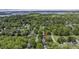 This aerial view shows the property's location in a residential neighborhood with mature trees and lake views at 8517 Sandowne Ln, Huntersville, NC 28078
