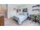 Bedroom features a ceiling fan, a closet with double doors, and a bed with blue bedding at 8517 Sandowne Ln, Huntersville, NC 28078