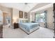 Bright bedroom features a vaulted ceiling, a ceiling fan, a comfy bed, and a window with patterned curtains at 8517 Sandowne Ln, Huntersville, NC 28078