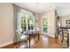 Cozy breakfast nook with hardwood floors and a large window, perfect for morning coffee at 8517 Sandowne Ln, Huntersville, NC 28078