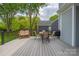 Enjoy outdoor dining on this spacious deck with a grill, seating, and views of the backyard at 8517 Sandowne Ln, Huntersville, NC 28078