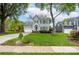 Traditional two-story home with a well-manicured lawn, driveway with basketball hoop, and black shutters at 8517 Sandowne Ln, Huntersville, NC 28078