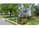 Charming two-story home featuring a lush front lawn, mature trees, and classic architectural details at 8517 Sandowne Ln, Huntersville, NC 28078