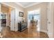 Spacious foyer with hardwood floors, showcasing the dining room and kitchen, providing an open flow at 8517 Sandowne Ln, Huntersville, NC 28078