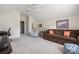 This is a spacious living room featuring a comfortable sofa, artwork, and lots of natural light at 8517 Sandowne Ln, Huntersville, NC 28078