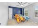 Bright bedroom featuring a ceiling fan, colorful bedding, and natural light from the window at 879 Knightsbridge Rd, Fort Mill, SC 29708
