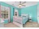 Cheery bedroom featuring blue walls, a white bed, and windows with pink and blue curtains at 879 Knightsbridge Rd, Fort Mill, SC 29708