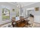 Bright dining area with a rustic table set and sunlit windows at 879 Knightsbridge Rd, Fort Mill, SC 29708