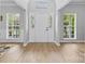 Bright and airy entryway with hardwood floors and stylish decor at 879 Knightsbridge Rd, Fort Mill, SC 29708