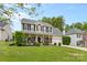 Charming two-story home with a welcoming front porch and lush landscaping at 879 Knightsbridge Rd, Fort Mill, SC 29708