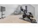 Upstairs home gym with a Peloton bike, TV, and lounge chair at 879 Knightsbridge Rd, Fort Mill, SC 29708