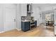 Well-appointed kitchen featuring modern appliances and beautiful blue and white cabinets at 879 Knightsbridge Rd, Fort Mill, SC 29708