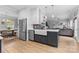 Open-concept kitchen with modern appliances, island, and easy access to the living room at 879 Knightsbridge Rd, Fort Mill, SC 29708
