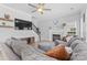 Spacious living room with a fireplace, stairs and large TV at 879 Knightsbridge Rd, Fort Mill, SC 29708