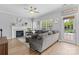 Cozy living room with fireplace, ceiling fan and access to the backyard pool at 879 Knightsbridge Rd, Fort Mill, SC 29708