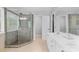 Nicely tiled bathroom features a glass shower, dual vanity, and ample lighting at 879 Knightsbridge Rd, Fort Mill, SC 29708