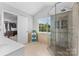 Modern bathroom with glass shower, tiled walls, and built-in bench seating at 879 Knightsbridge Rd, Fort Mill, SC 29708