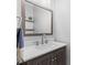 Stylish powder room boasts a floating shelf, framed mirror, and modern vanity at 879 Knightsbridge Rd, Fort Mill, SC 29708