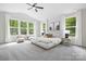 Bright and airy bedroom with large windows, plush carpet, and modern furnishings at 8937 Penstemons Dr, Charlotte, NC 28215