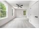 Bright bedroom with ample natural light, neutral walls, and carpeted floors at 8937 Penstemons Dr, Charlotte, NC 28215