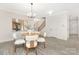 Cozy dining area with natural light from backyard view with stairway access at 8937 Penstemons Dr, Charlotte, NC 28215