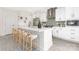 Well-designed kitchen featuring an island with seating, ample storage, and contemporary finishes at 8937 Penstemons Dr, Charlotte, NC 28215