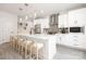 Contemporary kitchen with stainless steel appliances, white cabinetry, and a center island with seating at 8937 Penstemons Dr, Charlotte, NC 28215