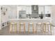 Stylish kitchen with a spacious island, modern fixtures, stainless appliances, and lots of counter space at 8937 Penstemons Dr, Charlotte, NC 28215