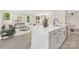 Open-concept living space with a modern kitchen island flowing seamlessly into the living room at 8937 Penstemons Dr, Charlotte, NC 28215