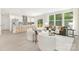Open-concept living area with a modern kitchen, large windows, and seamless indoor-outdoor flow at 8937 Penstemons Dr, Charlotte, NC 28215