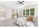 Bedroom featuring lots of natural light, plush carpet, and ensuite bathroom entrance at 8937 Penstemons Dr, Charlotte, NC 28215